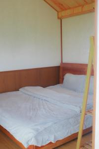 Een bed of bedden in een kamer bij An Yên Home