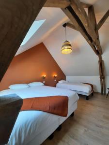 Posteľ alebo postele v izbe v ubytovaní Le Fournil du Bertry