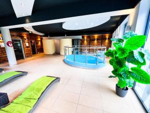 a large room with a swimming pool in a building at Modern Mountain Apart 4 in Rauris