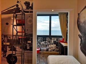 a bedroom with a view of the ocean at Hotel Perla in Riccione