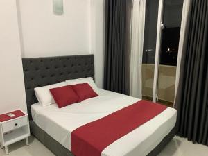 Кровать или кровати в номере Trend Marine Apartment, Colombo