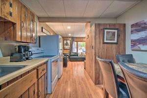 a kitchen with wooden cabinets and a counter top at James West Apt with 50 and Acres - Near Raystown Lake in Huntingdon