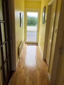 a hallway with a door leading to a hallway with a hallwayngthngthngthngth at ChestNut View Oldcastle 1 bed-room self catering in Oldcastle