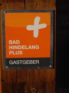 a sign for a bad hurdling plus gatekeeper at Alpenhotel Sonneck - mit Bergbahnticket in Bad Hindelang