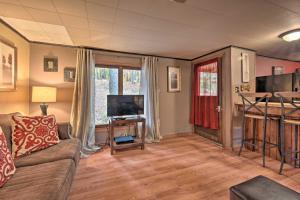 a living room with a couch and a tv at Matt Dillon Cabin about 1 Mile to Raystown Lake! in Huntingdon