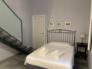 Posteľ alebo postele v izbe v ubytovaní DreamsApt Curtidores 6 Suites AT