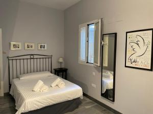 Posteľ alebo postele v izbe v ubytovaní DreamsApt Curtidores 6 Suites AT
