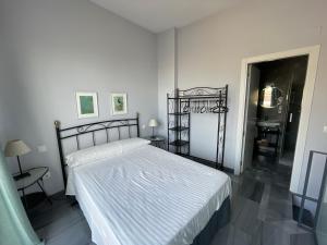 Posteľ alebo postele v izbe v ubytovaní DreamsApt Curtidores 6 Suites AT