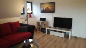 Una televisión o centro de entretenimiento en Ferienwohnung Twete
