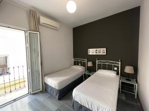 Posteľ alebo postele v izbe v ubytovaní DreamsApt Curtidores 6 Suites AT