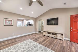 a living room with a flat screen tv at Gorgeous Bentonville Vacation Rental! in Bentonville