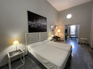 Posteľ alebo postele v izbe v ubytovaní DreamsApt Curtidores 6 Suites AT