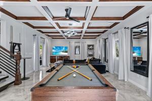 a pool table in the middle of a living room at California Oasis in Los Angeles