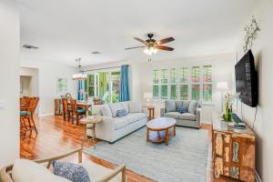 a living room with a couch and a table at Nihilani 32B in Princeville
