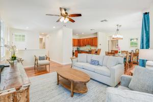 a living room with a couch and a table at Nihilani 32B in Princeville