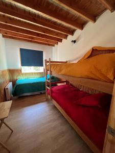 Cama o camas de una habitación en Hotel Cochamó