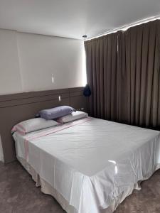 Postel nebo postele na pokoji v ubytování Duplex 3 qtos pé na areia
