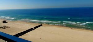 an aerial view of a beach with the ocean at Apart Hotel TLV/Bat Yam Beach Front 1207 in Bat Yam