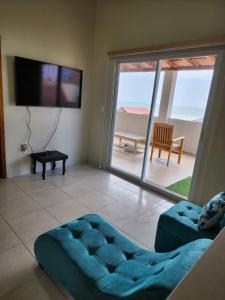 Μια τηλεόραση ή/και κέντρο ψυχαγωγίας στο Casa vacacional en San Jacinto Manabi