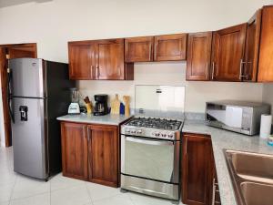 Η κουζίνα ή μικρή κουζίνα στο Casa vacacional en San Jacinto Manabi