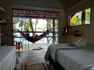Cama ou camas em um quarto em Pousada Lagamar