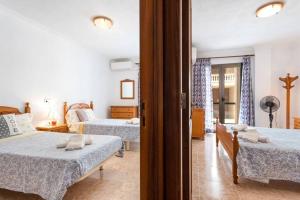 Postel nebo postele na pokoji v ubytování M0 Práctico y Sencillo Apartamento a 100 m de las mejores playas de Mallorca