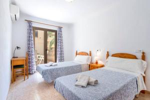 Postel nebo postele na pokoji v ubytování M0 Práctico y Sencillo Apartamento a 100 m de las mejores playas de Mallorca
