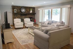 a living room with a couch and a fireplace at The Bavarian Village Resort in Branson