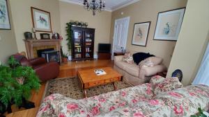 a living room with two couches and a coffee table at The Lark & Loon Inn in Annapolis Royal