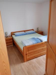 Postel nebo postele na pokoji v ubytování APARTMAN PALMA