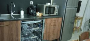 Kuchyňa alebo kuchynka v ubytovaní Appartement neuf et moderne au cœur de la Camargue