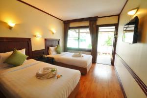 Postel nebo postele na pokoji v ubytování Isle Beach Resort Krabi-SHA