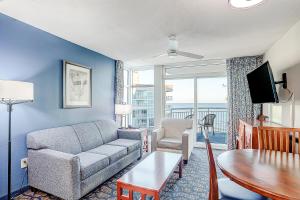a living room with a couch and a table at Ocean Blvd Resort, Unit #1234 in Myrtle Beach