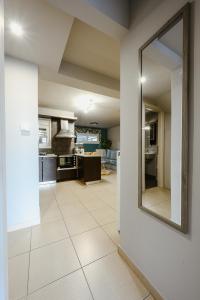 A kitchen or kitchenette at Le Petit Jardin #2