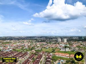 an overhead view of a city with houses and buildings at VACA Apartments at Imperial Suites in Kuching