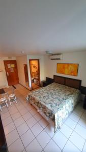 מיטה או מיטות בחדר ב-Marulhos Suite Resort