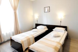 Postel nebo postele na pokoji v ubytování Astoria Hotel & Restaurant