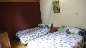 Postel nebo postele na pokoji v ubytování Arte sin Fronteras Hostel