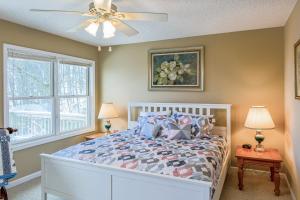 a bedroom with a bed and a ceiling fan at Stargazer's Retreat in Cullowhee