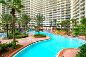 an aerial view of a resort pool with palm trees at Shores of Panama, Unit #1415 in Panama City Beach