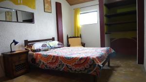 Postel nebo postele na pokoji v ubytování Arte sin Fronteras Hostel