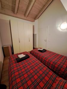 Postel nebo postele na pokoji v ubytování Appartamento Al Borgo