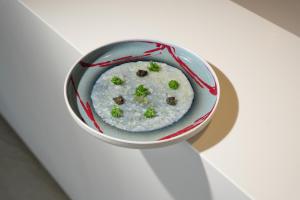 a bowl of rice with broccoli in it at Best Western Plus Sabaudia Hotel in Sabaudia