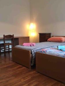 Giường trong phòng chung tại LA CASA DI AURORA