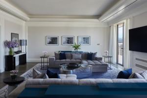 a living room with a couch and a table at Beverly Wilshire, A Four Seasons Hotel in Los Angeles