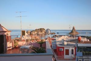 a view of the beach from the roof of a building at Casa Valastro in Aci Castello