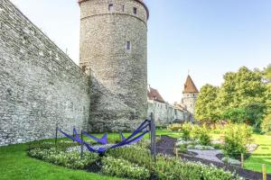 a castle with a blue ribbon in front of it at Old Town Tallinn Luxury Residence in Tallinn
