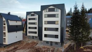 an image of three buildings in a city at Apartmani Aspen in Jahorina