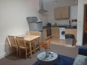 a kitchen and dining room with a table and chairs at Spacious. Contractors. Brierley in Brierley Hill
