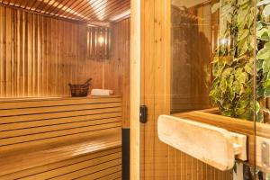 a bathroom with a sauna with a plant at Best Western Sjofartshotellet in Oskarshamn +86 photos